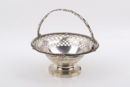 Possibly Irish silver footed basket with swing handle.