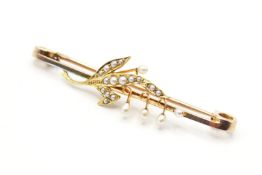 An Edwardian seed pearl set bar brooch with lilly of the valley motif.