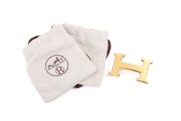 A Hermes brass belt buckle.