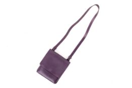 A small purple Mulberry handbag.