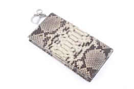 A Christian Dior Lady Dior python skin clutch.