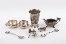 A collection of assorted silver and white metal items.