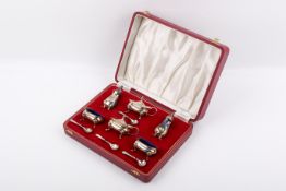 A Stirling silver hallmarked 10 piece cruet set, boxed.