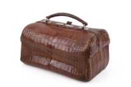 A 20th century Asprey & Son of London crocodile skin gladstone travelling bag.