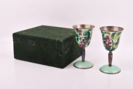A pair of modern Chinese silver with cloisonne decoration wine goblets, cased. 11cm.