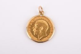 A 1911 half sovereign coin in a 9ct gold pendant mount. Gross weight 5g.