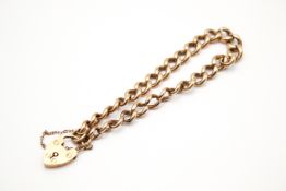 A yellow metal link bracelet.