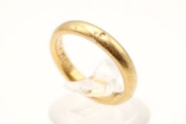 A 22ct gold wedding band. With engraved inscription to the inside, hallmarked, size J1/2, weight 5.