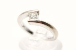 An 18ct white gold diamond solitaire ring. Set with one princess cut diamond of 0.