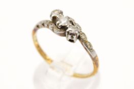 A three stone diamond crossover ring. With round brilliant cut diamonds of 0.