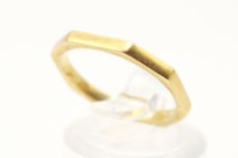 A yellow metal octagonal profile band ring.