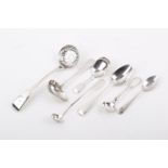 A group of seven assorted white metal flatware mostly spoons.