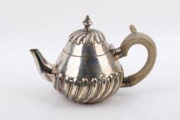 A small Victorian silver teapot.