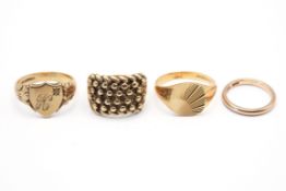 Four assorted 9ct gold rings.