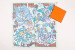 A Hermes Duels Oniriques pale turquoise silk scarf. Boxed with tag.