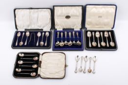 Five sets of silver tea and coffee spoons.