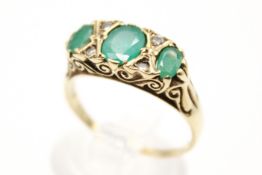 A hallmarked 9ct gold and emerald dress ring.