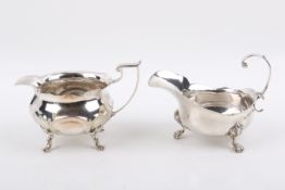 Two Stirling silver hallmarked footed cream jugs. Consisting of Sheffield, 1913, 'J.
