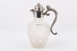 An Edward VII hallmarked Stirling silver mounted carafe jug.