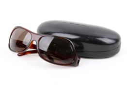 A pair of ladies Gucci sunglasses.