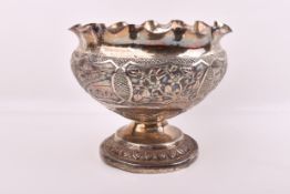 A large probably Indian white metal pedestal bowl.