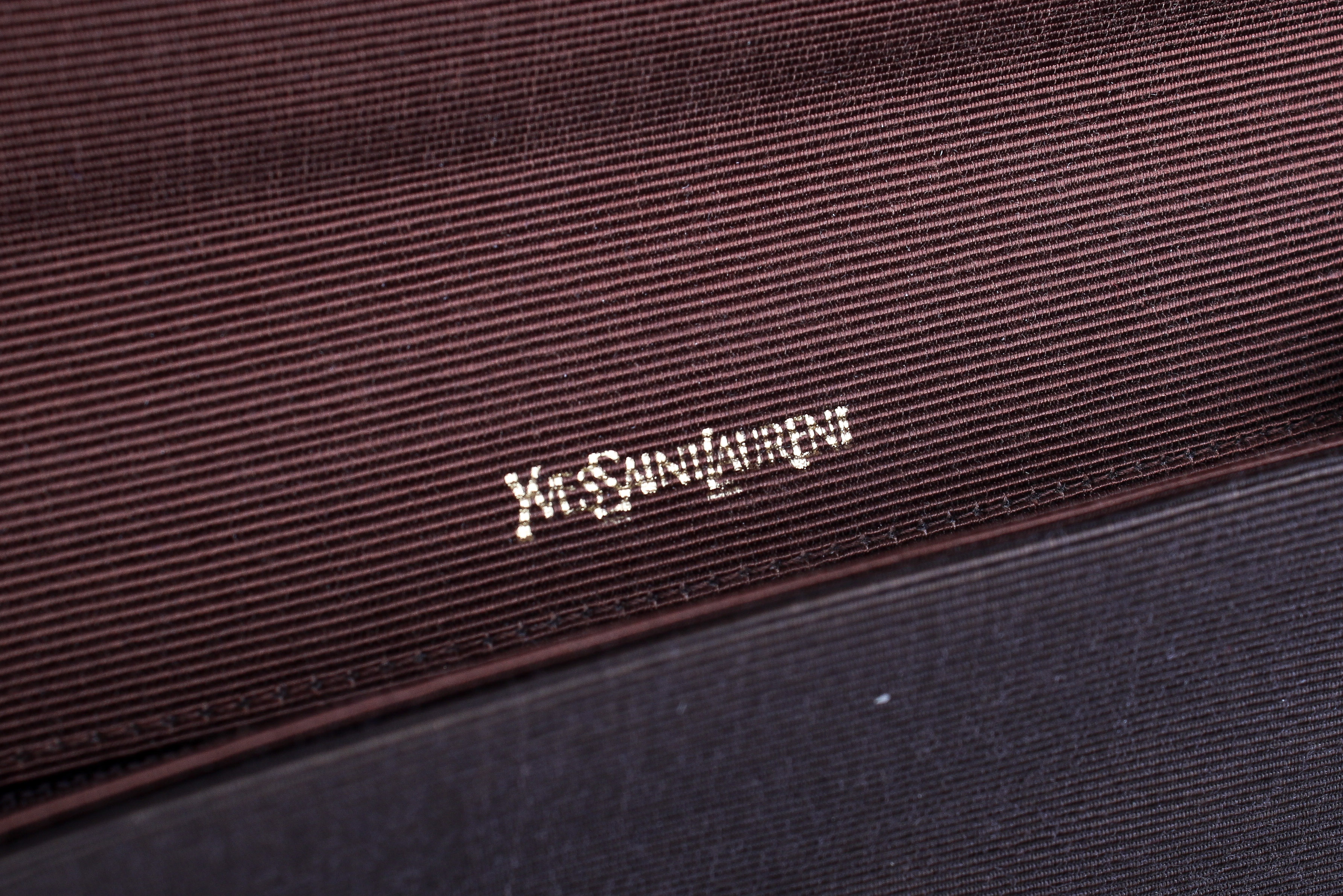 A vintage Yves Saint Laurent brown woven clutch. - Image 3 of 3