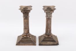 A pair of weighted Stirling silver hallmarked candlesticks.