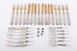 A mahogany canteen of continental silver gilt cutlery and scrap hallmarked silver.