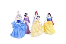 Six Royal Doulton Disney princesses.