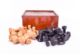 A full set of carved wooden Stauton chess pieces, boxed. King H7.
