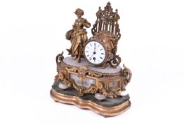 A late 19th Century gilt metal and alabaster figural mantel clock.