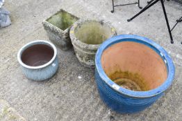 Four assorted garden planters.