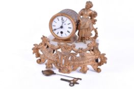 Gilt metal and alabaster figural mantel timepiece. Pendulm and key present.