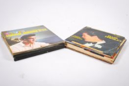 A collection of assorted Elvis Presley vinyl LP records. Including two box sets, in a carry case.