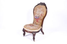 A Victorian mahogany nursing chair.