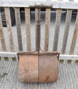 An antique cast iron garden roller.