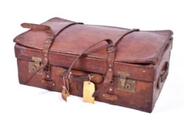A large vintage leather suitcase.