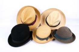 A group of assorted vintage hats.