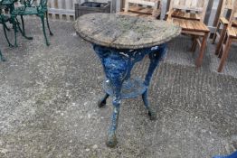 A 20th Century blue cast metal garden pub table with wooden top (heavily weathered and warped)