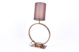 A Pooky Oriel contemporary brass table lamp. Model TL ORI 101 BRA BRA, raised on a rectangular base.