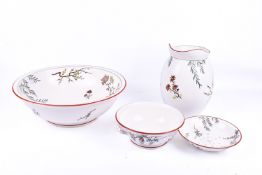 A Minton three-piece wash basin and pitcher set. Decorative branch and floral pattern.