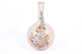 A large opaque glass enamel decorated bottle shape vase. Decorative floral painted front.