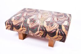 A large ottoman style reception seat stool of rectangular form. Having iLiv Eames style upholstery.