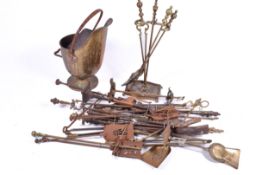 Large quantity of assorted brass fireside companions and large coal scuttle.