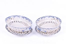 Pair of late 19th Century creamware pierced oval baskets and stands by Boch, Luxembourg.