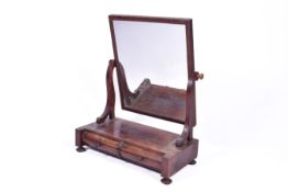 19th Century mahogany box base dressing table mirror. Having two drawers raised on squat bun feet.