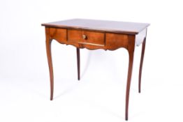 A 20th century French style writing or side table with single drawer. Raised on cabriole supports.