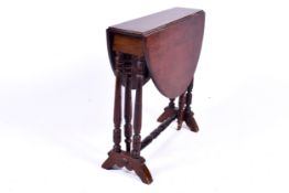 A 20th Century mahogany drop leaf side table. Raised on turned supports and central stretcher.