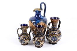 Pair of Royal Doulton stoneware two handles vases, a matching larger vase and a ewer.