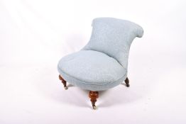 A 20th century nursing style chair.